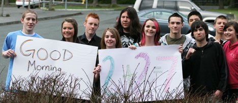 South Whidbey High School students from teacher  Andy Davis’ applied math class wish a good morning to principal Rob Prosch as a way of showing support for the boycott against a planned “walkout” on Thursday.