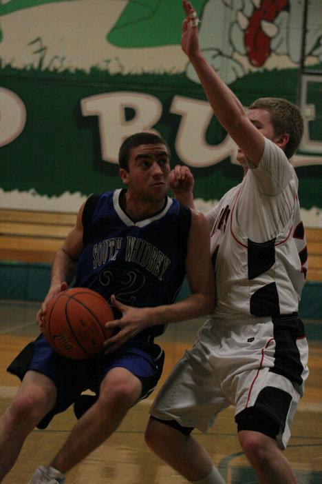 Jordan Thornley makes a move inside against Tony Degrazia of Archbishop Murphy during the Falcons' win in the second round of the Northwest District tournament.