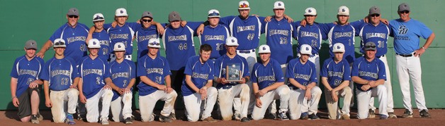 The South Whidbey baseball team poses for one last group photo with the WIAA 1A tournament second-place trophy.