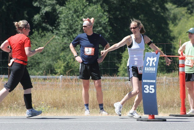 Racers on the team Therapy On The Run make the final exchange at last year’s Ragnar Relay.