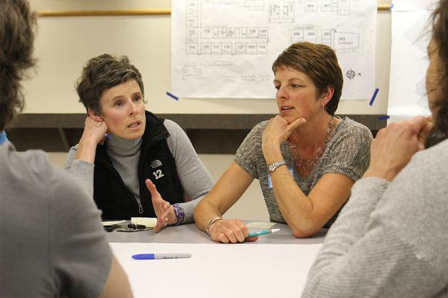 Erin Simms (left) and Shelly Ackerman (right) discuss questions and concerns about South Whidbey School District’s facility usage at a meeting Wednesday night.