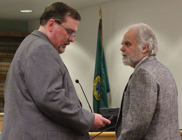 Accused murderer Robert Baker speaks with attorney Tom Pacher during the first day of trial.