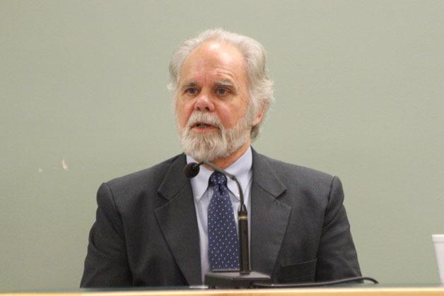 Accused murderer Robert Baker answers questions on the stand Friday in Island County Superior Court.