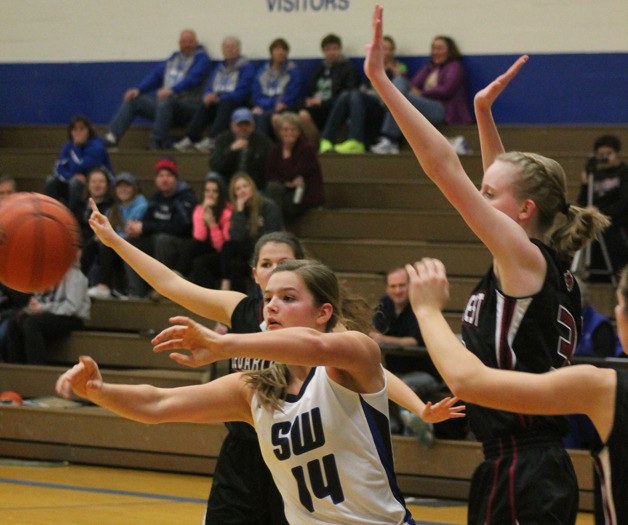 Falcon sophomore Kinsey Eager passes to the perimeter after looking for an interior shot against Cedarcrest on Jan. 9 at South Whidbey High School.