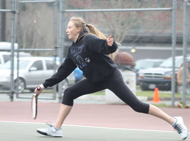 South Whidbey freshman Mary Zisette’s first experience as a varsity girls tennis player was brief