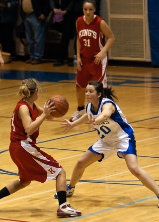 Falcon defender Reilly O’Sullivan tries to keep Lady Knight Laura Friar from scoring  during South Whidbey’s 55-34 victory on Tuesday.