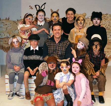 Newly-named interim Artistic Director Ken Martinez is surrounded by the cast of Whidbey Children’s Theater’s “Winnie the Pooh.”