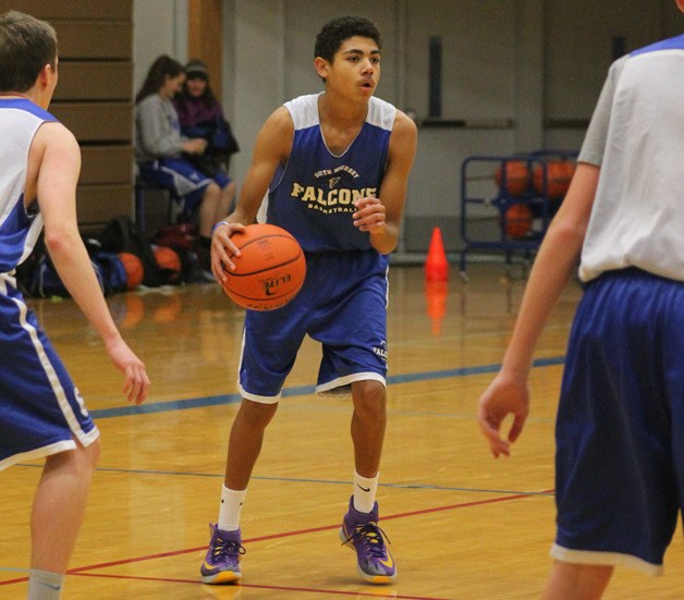 Falcon freshman Lewis Pope looks for an open player during a live scrimmage Monday. He will be the starting point guard for South Whidbey in its first game.