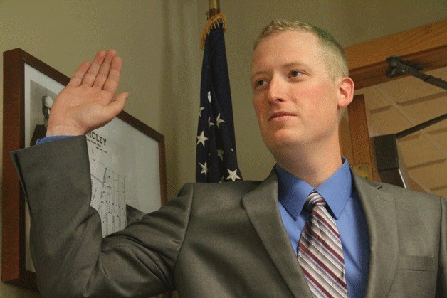 Luke Adkins swears in at Langley City Hall as the newest officer in the Langley Police Department on May 5.