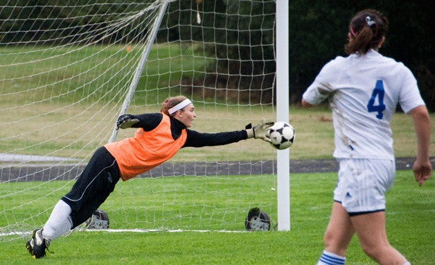 Ellie Greene’s dive is just short of saving a Wildcat goal Saturday.