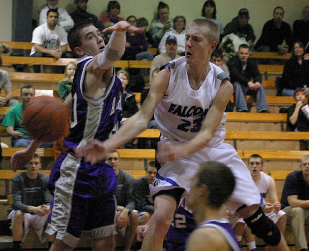 Riley Newman drives around Tigers senior Eric Wasler. Newman was the defensive focus of Burlington-Edison during the first-round District 1 playoff game