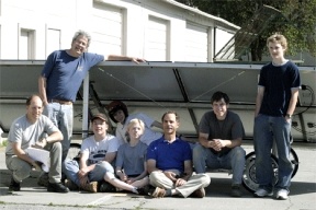 The South Whidbey solar-powered drag racing team shows off the vehicle they plan to race on June 23 in Wenatchee. From left are Jay Freundlich