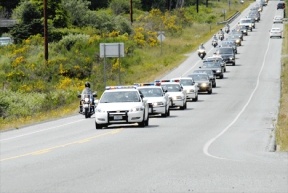 A line of police and emergency response vehicles