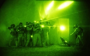 U.S. forces demonstrate tactics used to enter homes by the Iraqi counterterrorism force comprised of coalition and Iraqi forces in Baghdad in this June 26 photo. On Wednesday