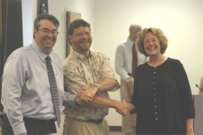 School board president Rich Parker welcomes two new principals Thursday night: South Whidbey High School's Rob Prosch and Jamie Boyd at the elementary school. Boyd was named earlier that day to replace Eric Nerison.