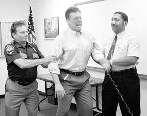 Island County Sheriff Mike Hawley shakes as he's jolted with 50