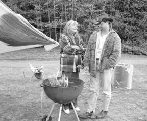 Sheri and Carl Campbell are homeless living at the Island County Fairgrounds with their two children. The barbecue does double duty as a stove and a heater on cool days.