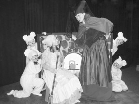 Jennifer Zisette as Cinderella (seated) takes orders from her wicked stepmother