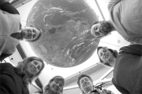 Organizers of the Earth Day Celebration gather under the Earth Ball at the Bayview Cash Store in preparation for Sunday's activities. From left are Marian Myszkowski