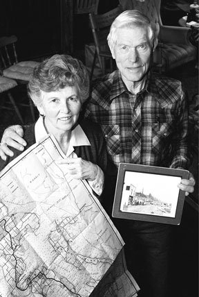 Norma and Jack Metcalf at home in their log house on Saratoga Passage