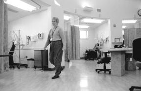 Whidbey General Hospital nurse Renee Yanke walks through the hopsital’s new cancer treatment ward. Islanders who use and pay for the hospital through property taxes will no longer get a break on their bills due to a change in Medicare law.