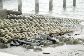 Damage to the Bush Point boat launch ramp can be seen after the last big windstorm; sand beneath two dozen concrete grid blocks washed away