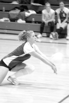 Caitilynn Larmore gives her all to return a King serve Thursday night. The young volleyball team is struggling a bit early in the season