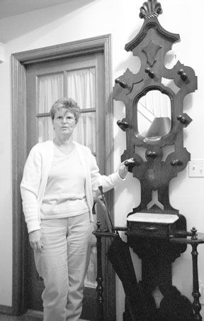 Linda Wilson of Freeland has filled her home with 200-year-old antiques that belonged to her New England ancestors. The mirrored hat tree belonged to her great-great grandfather.