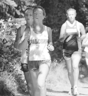 Freshman Katy Gordon runs to keep up with teammate Nancy Godsey at the Westling Invitational Saturday. Gordon was the fourth scoring runner in for the Falcons