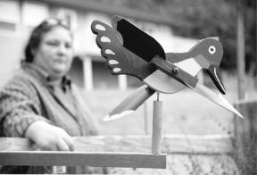 Only one of 25 "wind toys" on Mona and Gary Turner's Beverly Beach fence was left behind by the thieves that stole the other yard ornaments sometime late last week.