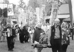 Celebrants at a recent Earth Day event on Whidbey enjoy music and activities. The Whidbey Institute will host this year's celebration Saturday.