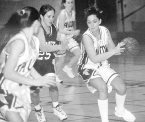 Julie Robinson races down the court on the Falcons' opening scoring drive Saturday night.