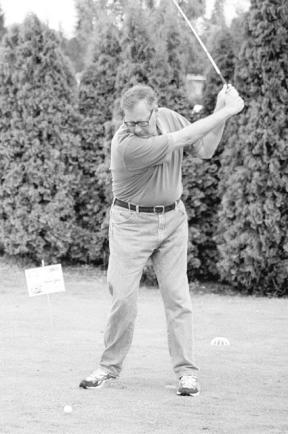 Whidbey News-Times Editor Jim Larsen tees off last weekend at Holmes Harbor Golf Course during the Matt Moss Benefit Golf Tournament. If the photo looks unusual