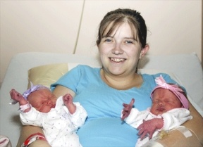 Kimberly Kuschnereit holds her twin daughters Baylie and Carlie at Whidbey General Hospital. The hospital helped deliver two sets of twins Tuesday for the first time in hospital history.