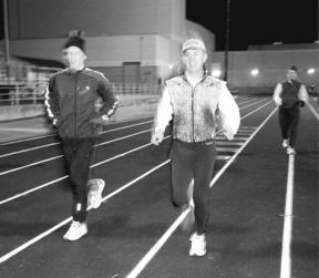 Leading a running clinic Thursday night at the South Whidbey High School track