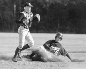 Conley White gets the out on a sliding Lakewood runner on April 30.