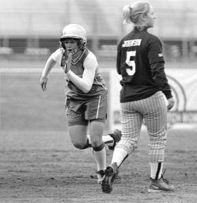 Sophomore Carolann Lubach heads home from second base in the third inning of Monday's 12-1 win over Meridian.