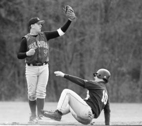 Senior Andrew Matthis shows the umpire that he got the putout against a Burlington-Edison player at second base in Saturday's game.