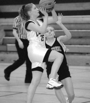 Caitilynn Larmore goes up for the first of her 10 points in Thursday's eighth-grade girls basketball game against Heatherwood.