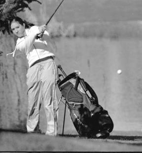 Freshman Jenna Lindus aims for the fairway as she works out of the rough on her way to the first green at Useless Bay Thursday.