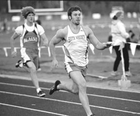 Running at a home meet earlier this spring