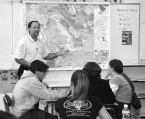 South Whidbey High School teacher Eric Sturgis leads his Current World Problems class in a recent discussion about the war in Iraq.