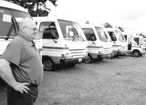 Island Transit Maintenance Manager George Haigh looks over surplus buses that will soon be available to nonprofit groups. Island Transit has almost 30 buses ready to be awarded.