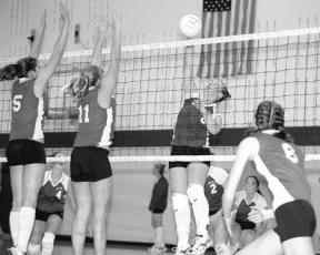 Jordan Tobler bangs the ball back for a kill against Shorewood during the Falcons’ second win at their invitational Saturday.