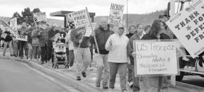 Marchers progress toward Whidbey Avenue during Saturday’s rally.  People came from as far away as Renton to participate.