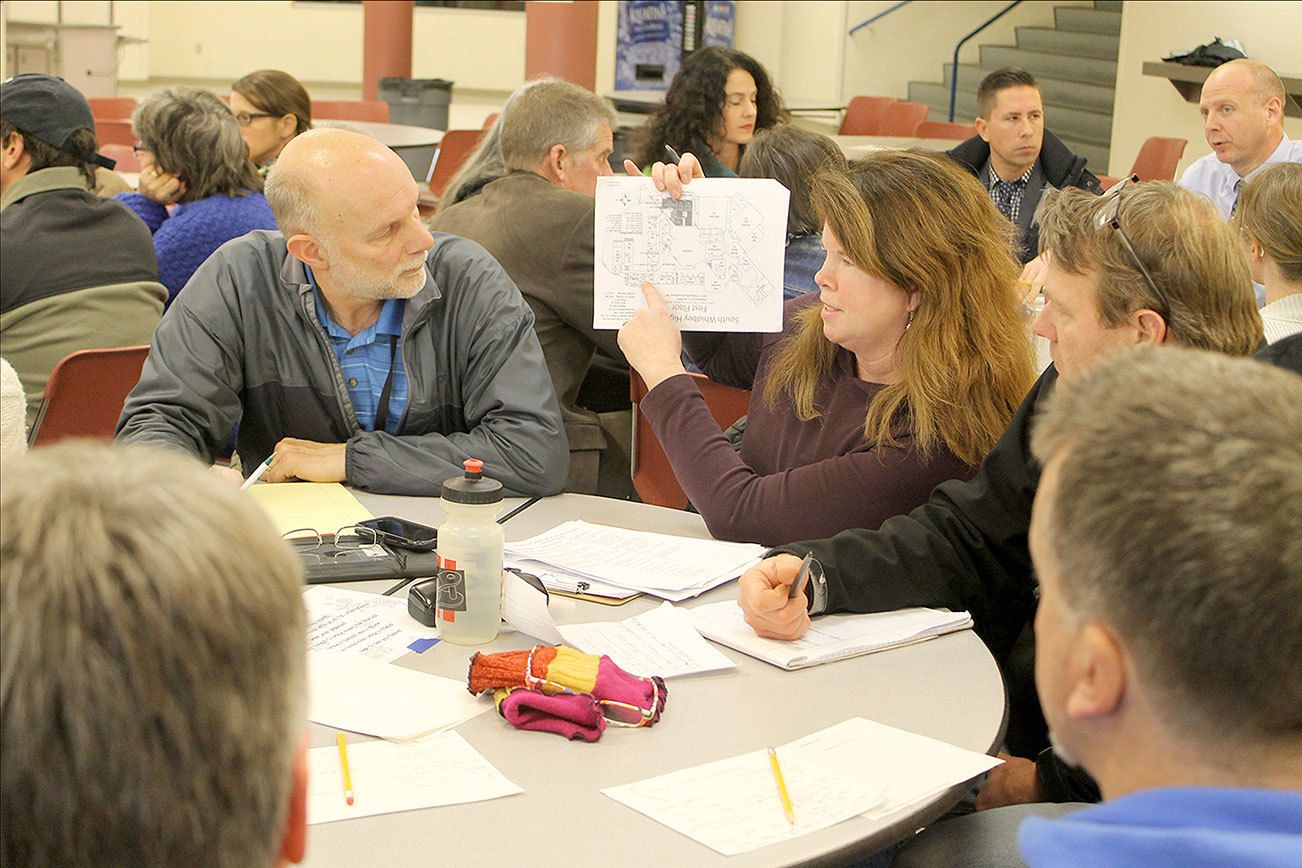 Evan Thompson / The Record                                Lori O’Brien, a parent of two in the South Whidbey School District, discusses challenges associated with the potential closure of Langley Middle School at a community meeting on Wednesday night at South Whidbey High School.