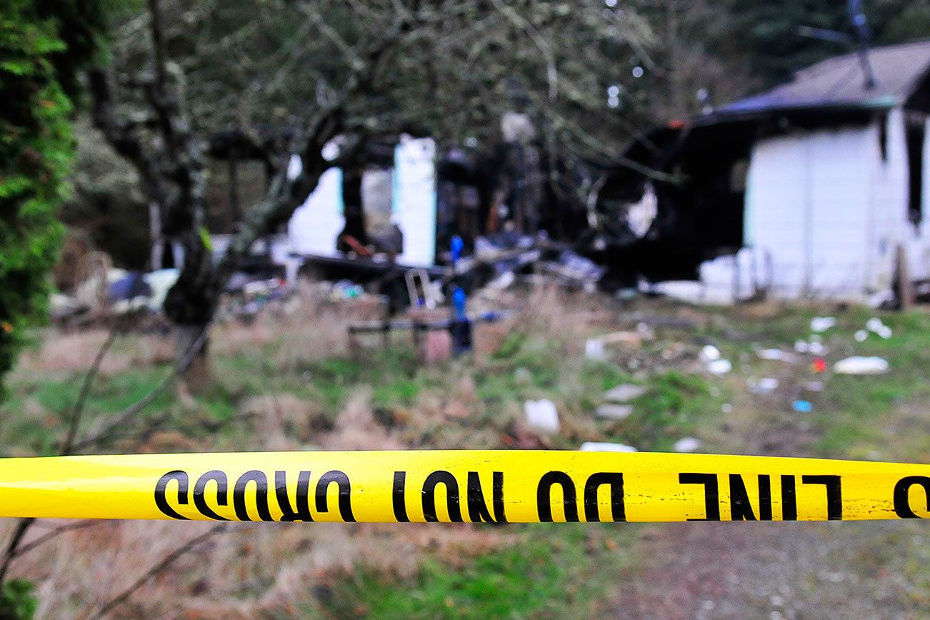 Michael Watkins / Whidbey News Group                                Authorities are still investigating the cause of a residential fire in the 4000 block of DeGraff Road that claimed the lives of a mother and her two young children Sunday in Oak Harbor.