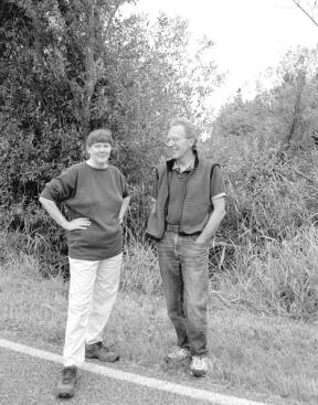 Friends of Freeland board members Janis Admanson and Johnny Palka stand at the edge of 26 acres on Newman Road and Double Bluff Avenue in Freeland that has been given to the organization.