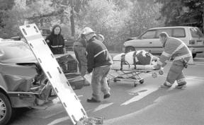 Fire District 3 personnel prepare to transport Ray Swan