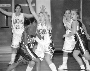 Karen Schwager gets in the face of a Chimacum player Tuesday. The Falcons locked Chimacum out of the offensive zone for most of the 69-28 win.